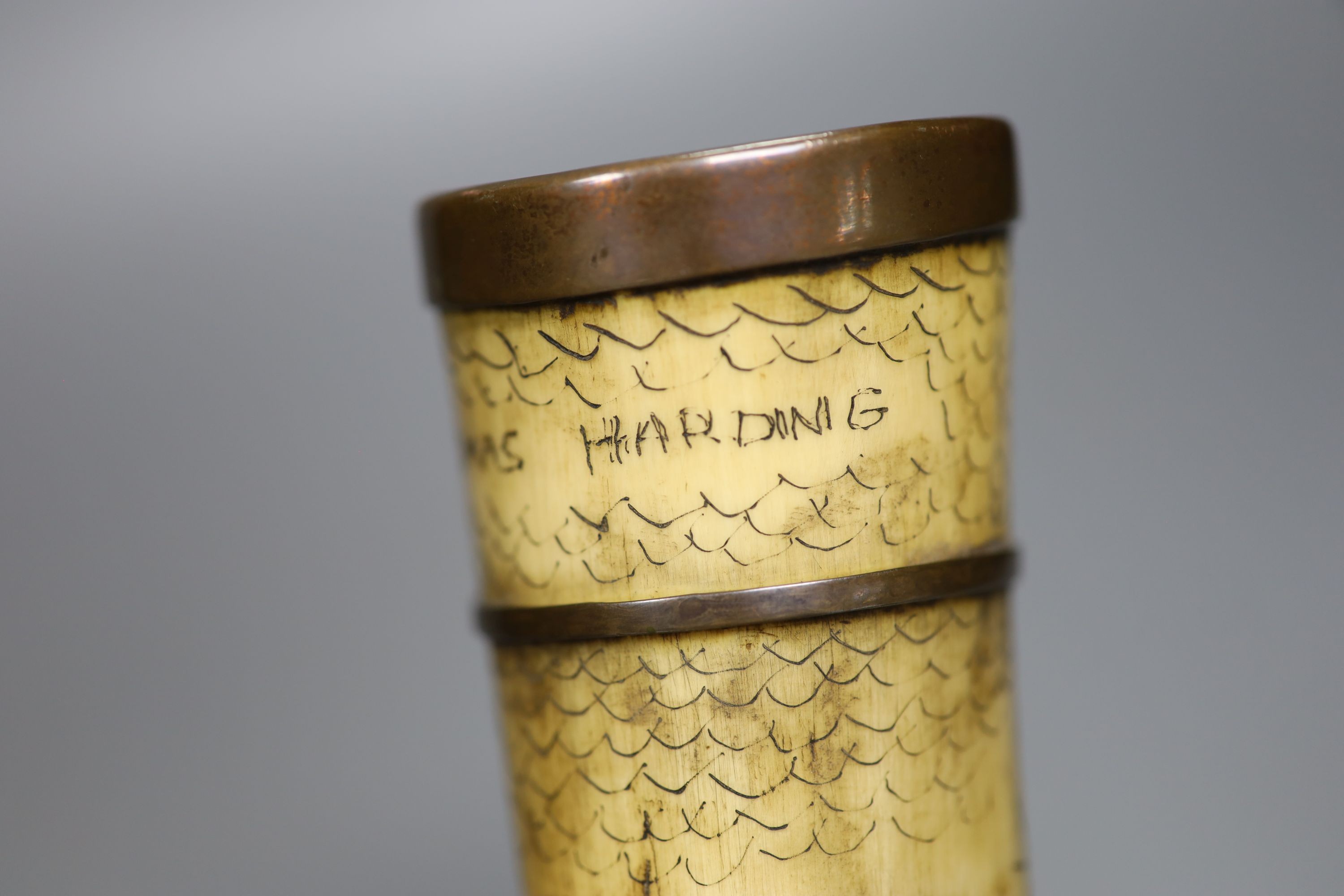 A scrimshaw horn beaker, bearing date 1837, 28cm